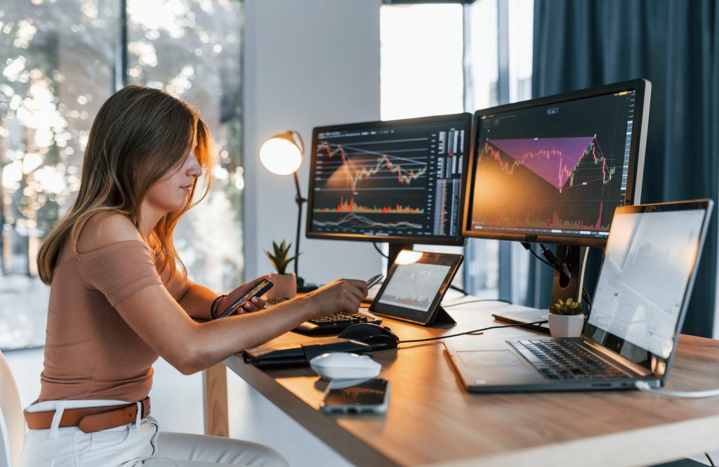 Stock trading workspace with multiple screens